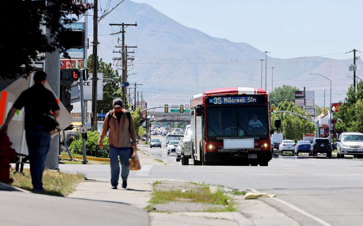 A Utah Transit Authority bus moves east on 3500 South at Redwood Road in West Valley City on Monday.