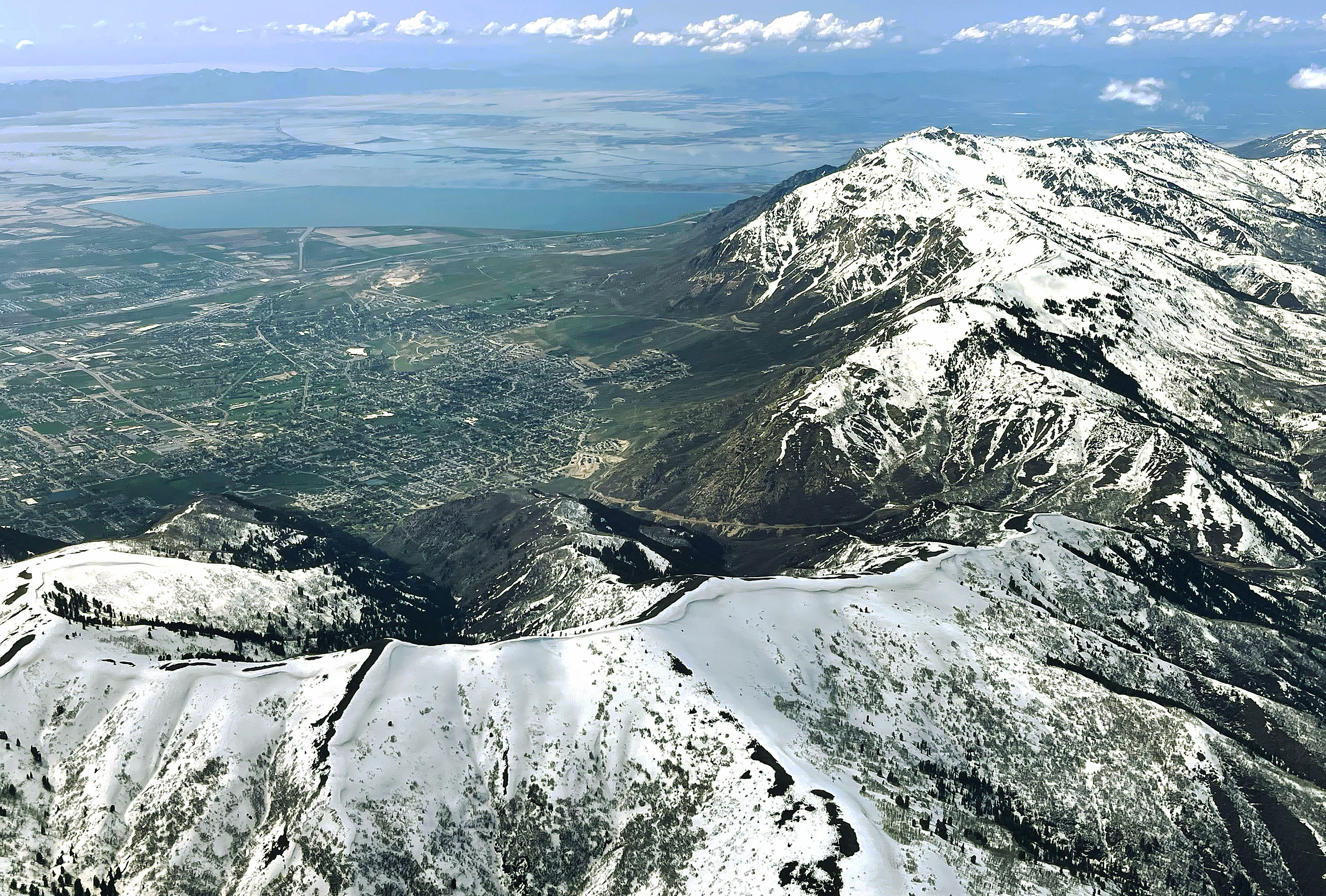 Snowpack on the mountains above Ogden and the Great Salt Lake on May 9. Utah water managers are working on a plan to better understand and manage water in the Great Salt Lake Basin, which can help get water to the struggling lake.