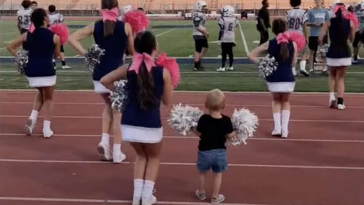 Two-year-old Liam from Pflugerville, Texas, has all the moves down to accompany his sister’s middle school cheerleading squad.