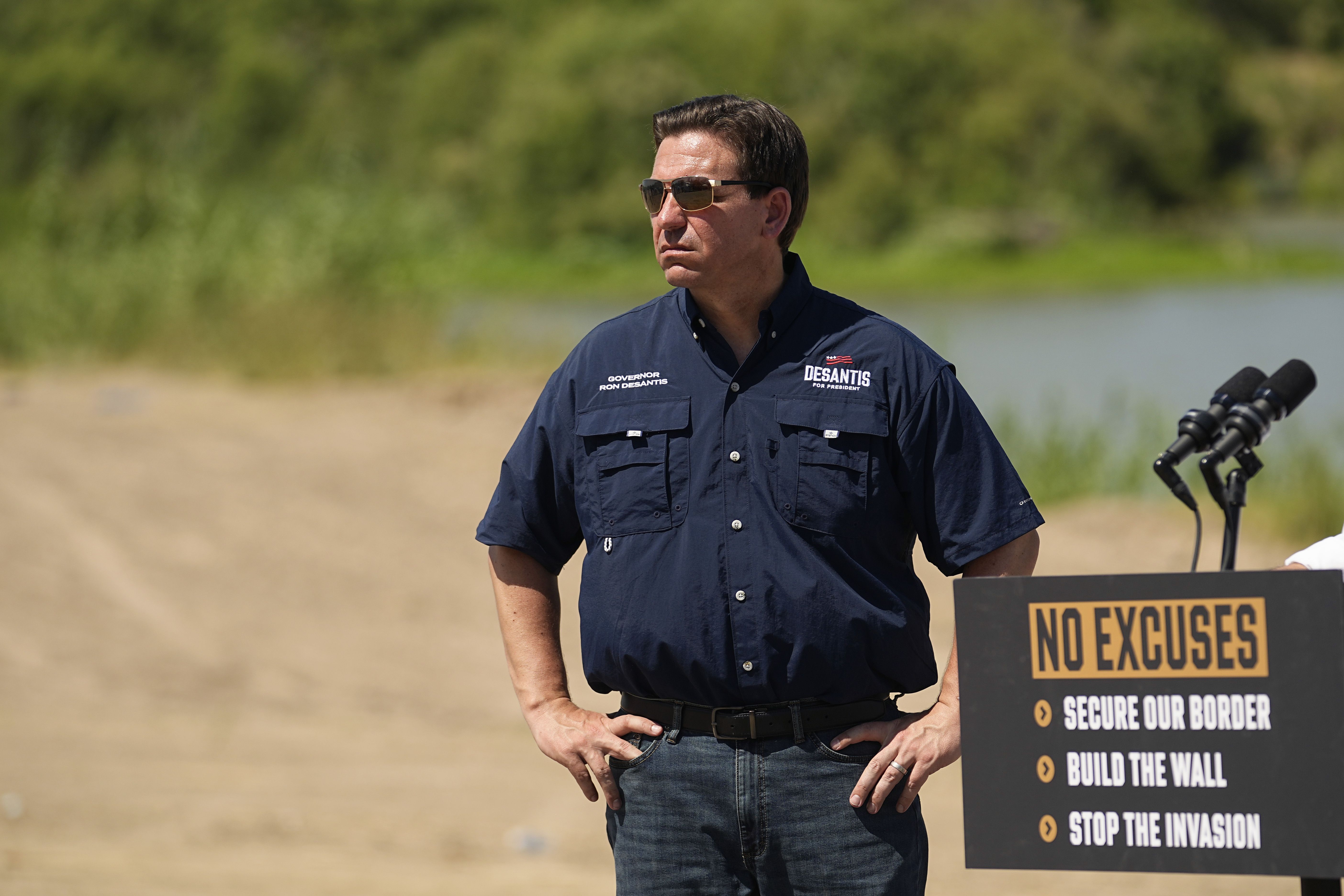 Republican presidential candidate Florida Gov. Ron DeSantis waits to speak at a news conference along the Rio Grande near Eagle Pass, Texas, Monday. DeSantis unveiled elements of his immigration policy during the event.