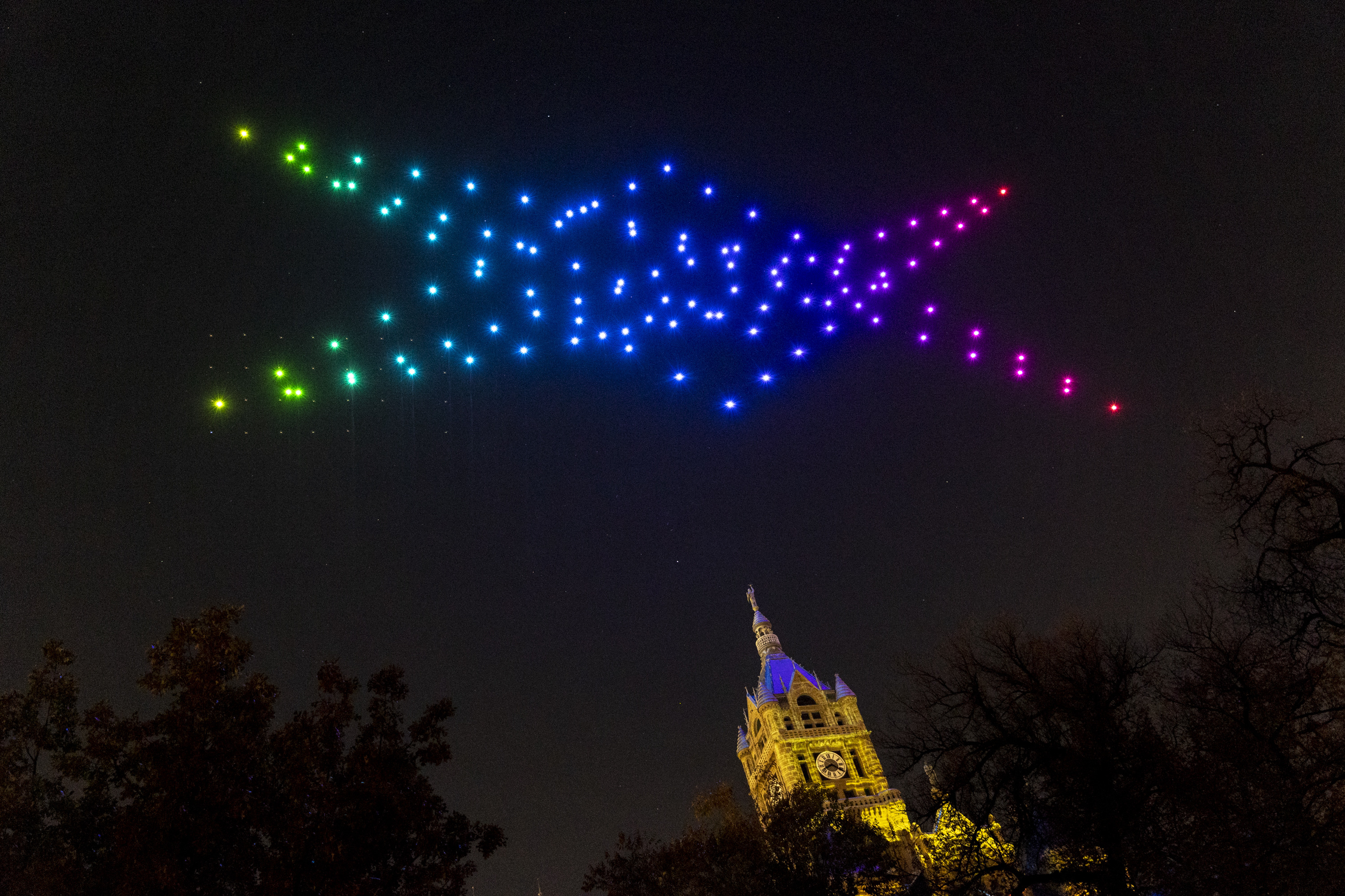 Attendees watch as 150 drones perform at ILLUMINATE: Light Art + Creative Tech Fest in Salt Lake City on Nov. 11, 2022. Salt Lake City will sponsor drone shows as an alternative to fireworks for the July 4 and Pioneer Day holidays.