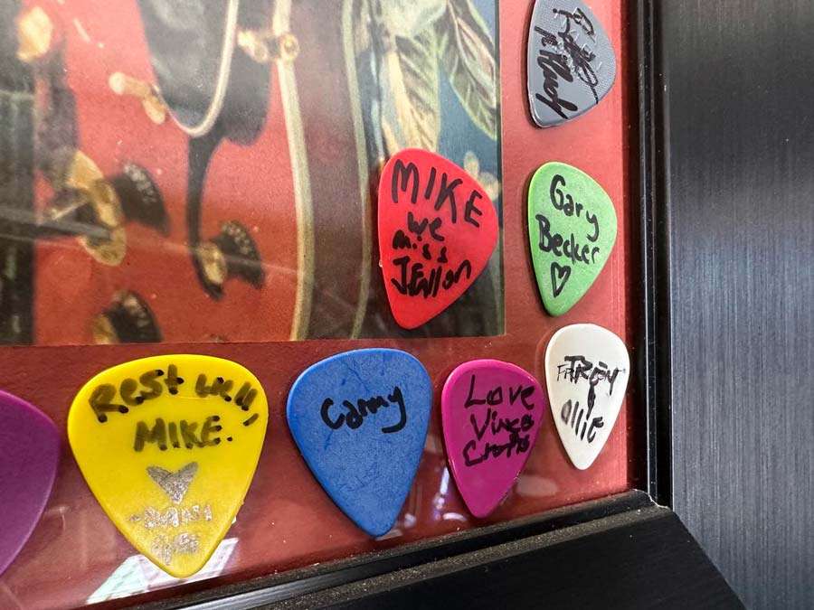 The red pick that Jimmy Fallon signed is framed.