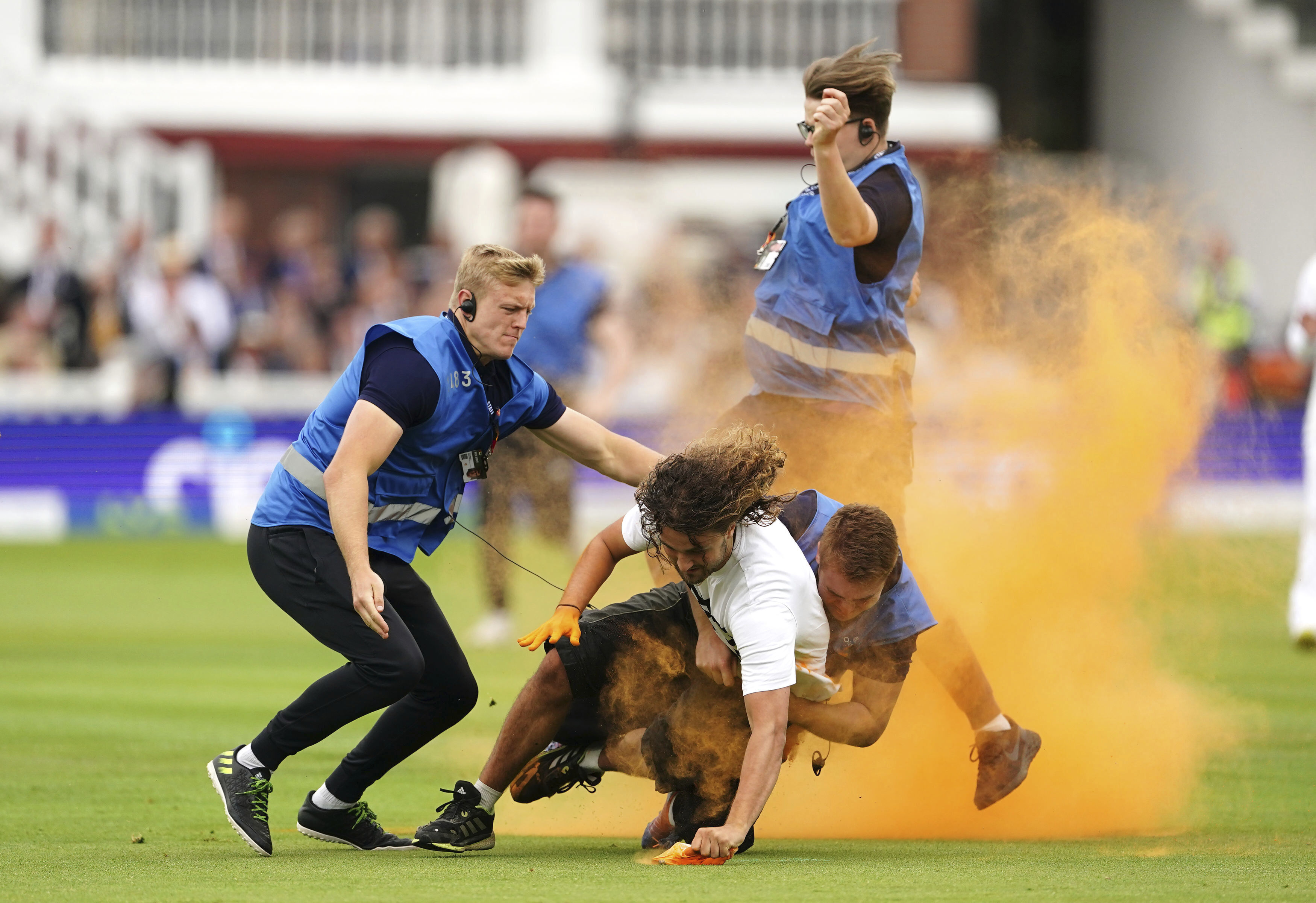 Security grab a Just Stop Oil protester during day one of the second Ashes Test cricket match at Lord's Cricket Ground, London, England, Wednesday, June 28, 2023. 