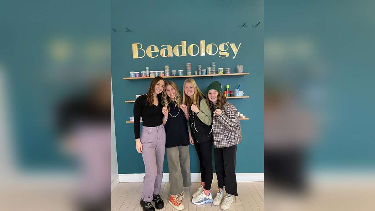 Beadology owner Maysen Minor, left, shows off beaded creations with some of her customers. Experience-based businesses like Beadology, in Provo, are becoming popular in Utah.