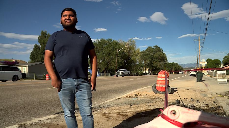 Brian Bueno stands where he rescued a man from a crashed, burning car in Wellington, Carbon County.