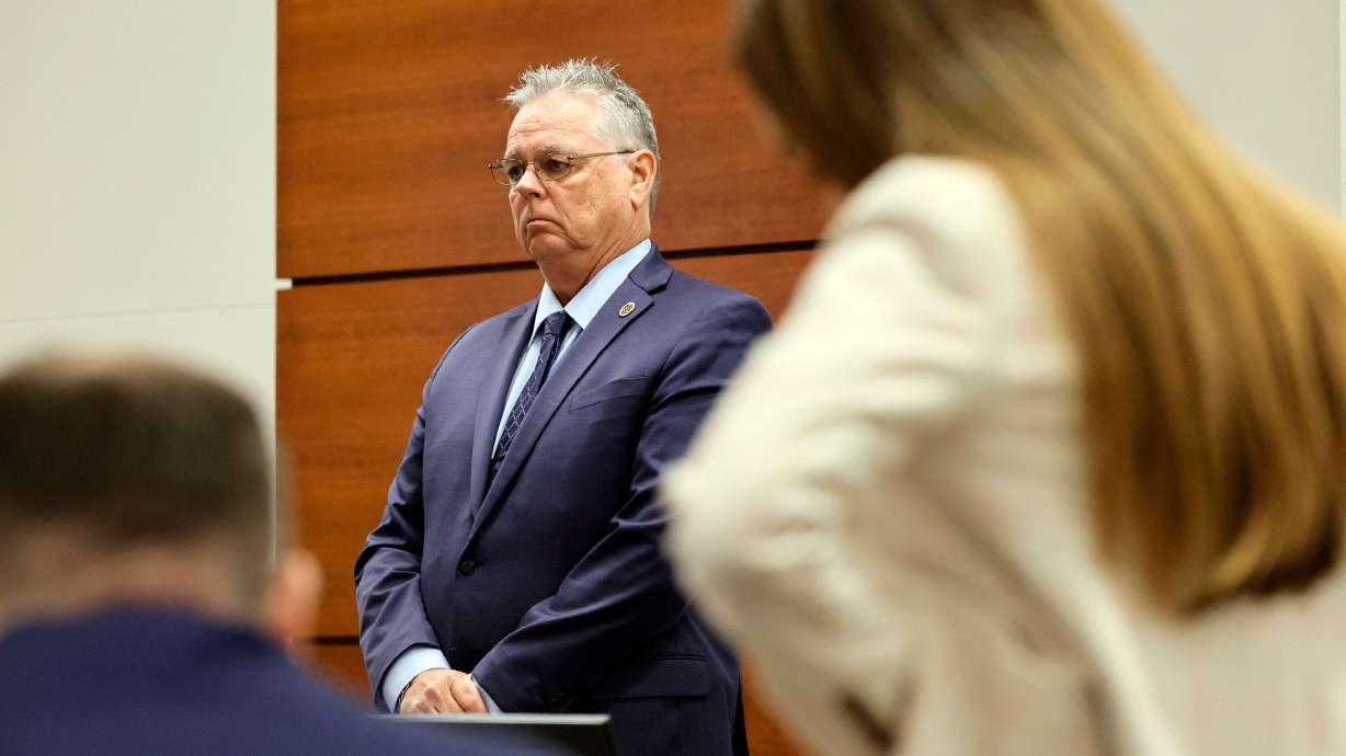 Scot Peterson stands behind the defense table last week during his trial. He was acquitted Thursday of felony child neglect and other charges for failing to act during the 2018 Parkland school massacre.