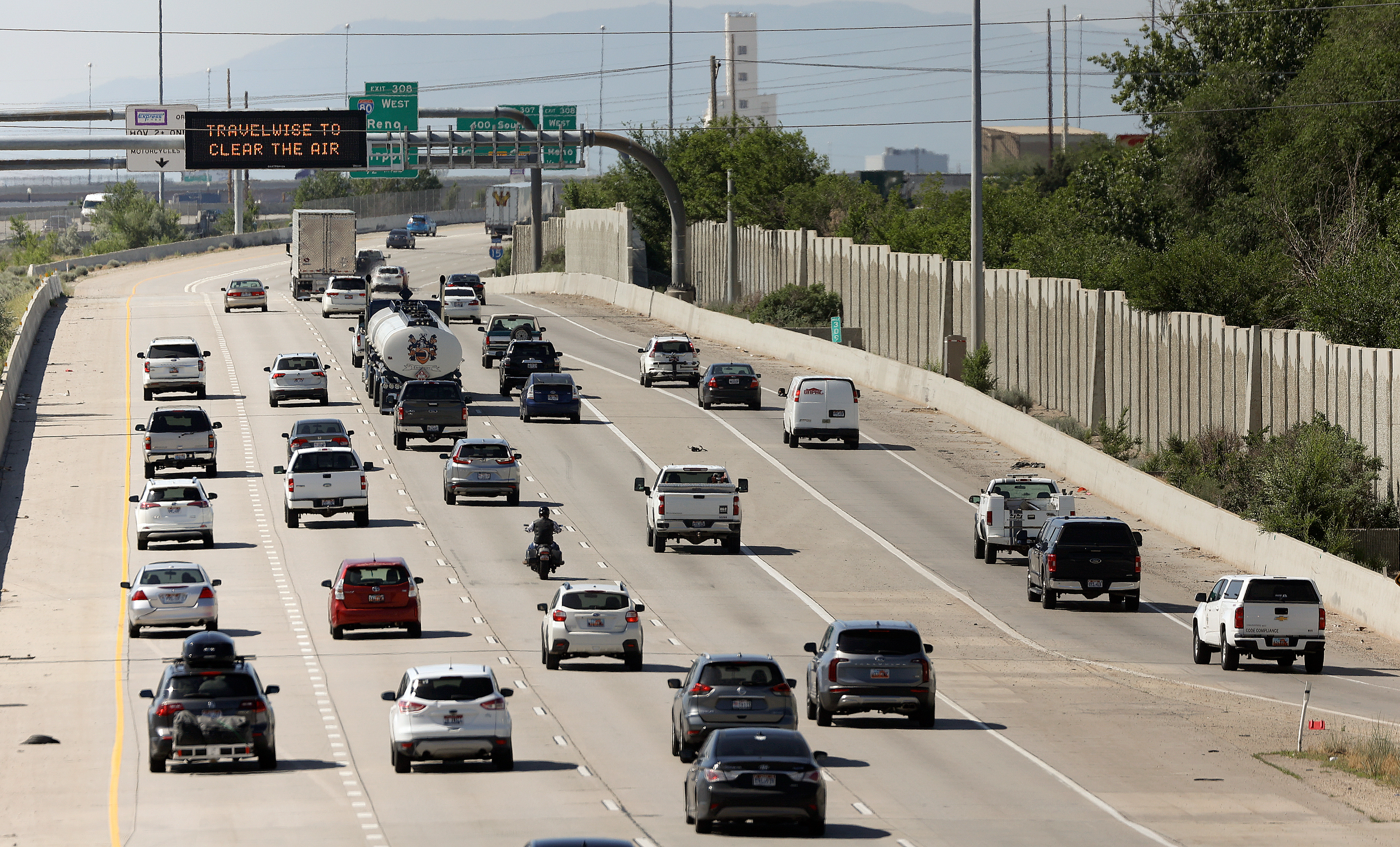 Vehicles travel on I-15 in Salt Lake City on June 16, 2023. National travel experts expect that 2024 will end with a bang, but the timing of Christmas and New Year's could reduce issues for travelers.
