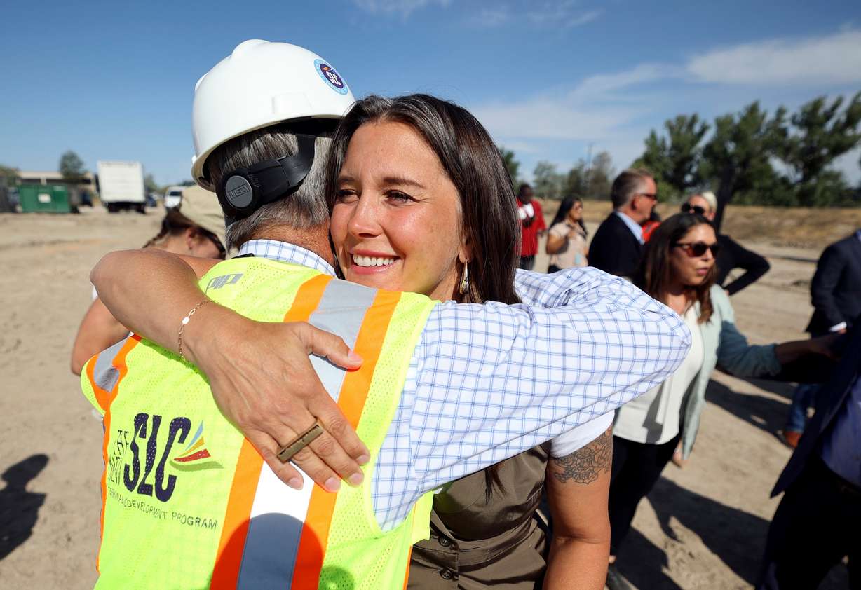 Bill Wyatt, Salt Lake City International Airport executive director, hugs Salt Lake City Mayor Erin Mendenhall at a groundbreaking ceremony for Delta’s future pilot training facility in Salt Lake City on Thursday.