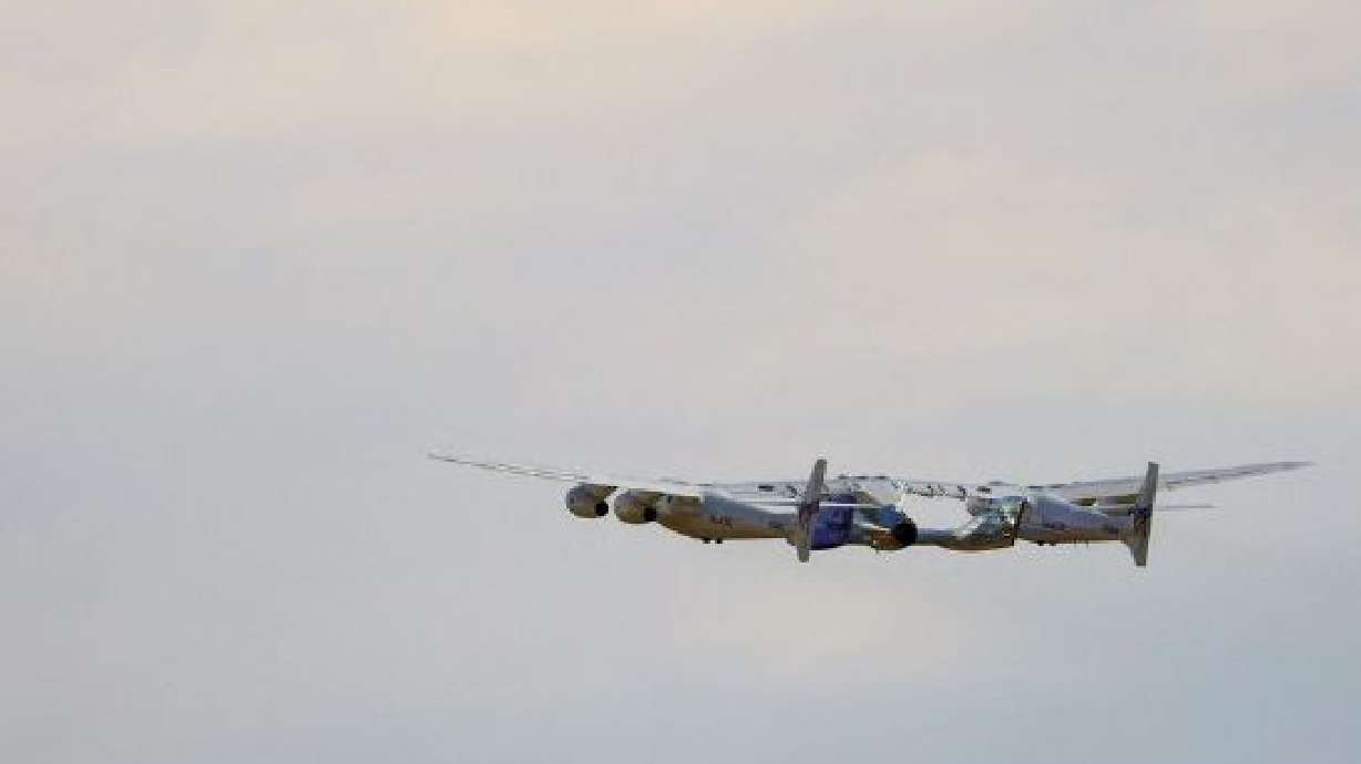 The passenger rocket plane operated by Virgin Galactic lifts off during the company's first commercial flight to the edge of space, at the Spaceport America facility, in Truth or Consequences, New Mexico, Thursday.