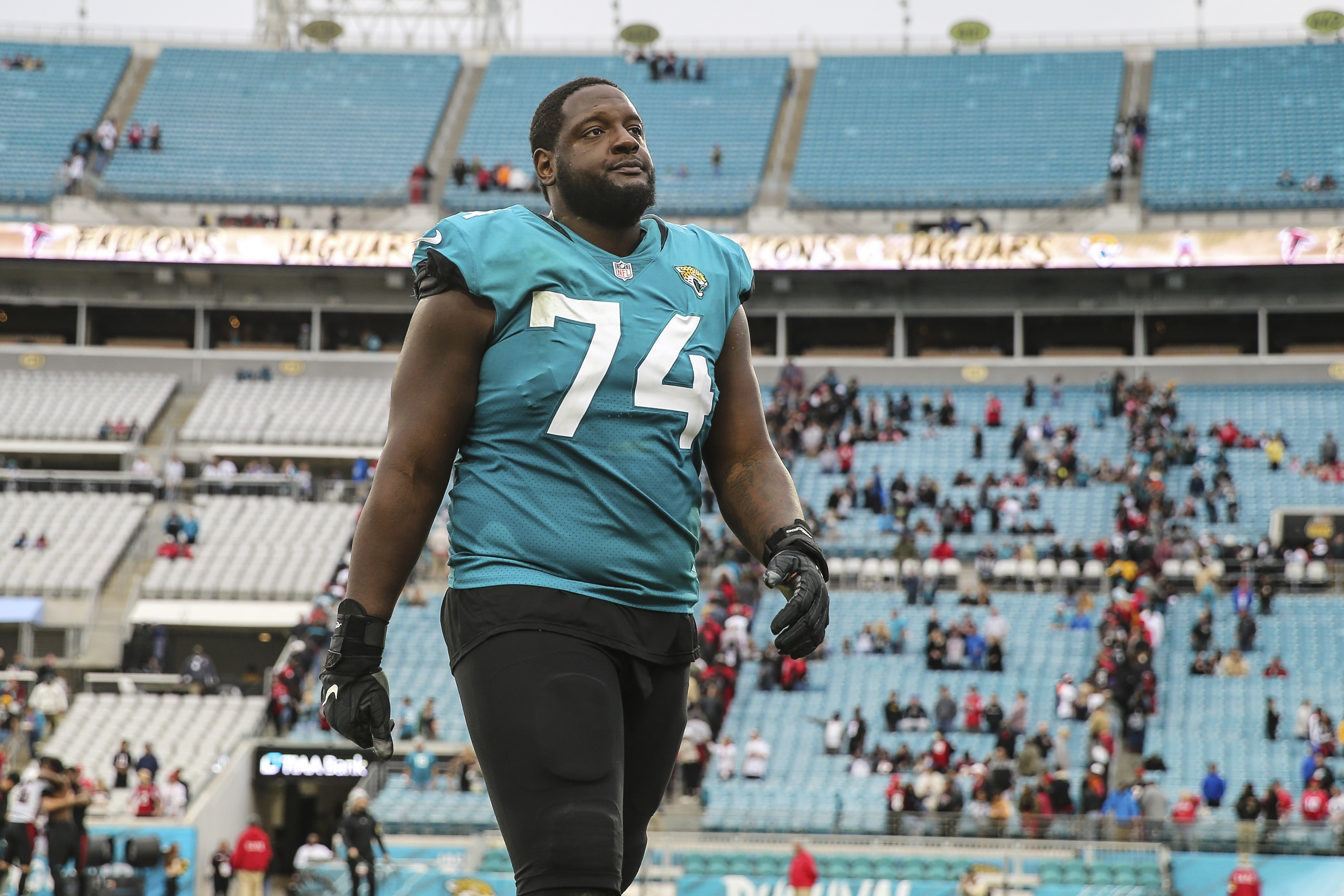 FILE - Jacksonville Jaguars offensive tackle Cam Robinson (74) walks off the field after an NFL football game against the Atlanta Falcons, Nov. 28, 2021, in Jacksonville, Fla. The NFL suspended Robinson, Thursday, June 29, 2023, for the first four games of the regular season for violating league policy on performance-enhancing drugs.