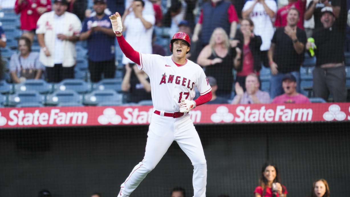Los Angeles Angels designated hitter Shohei Ohtani (17) reacts after scoring off of a triple hit by Mike Trout during the first inning of a baseball game against the Chicago White Sox in Anaheim, Calif., Wednesday, June 28, 2023.