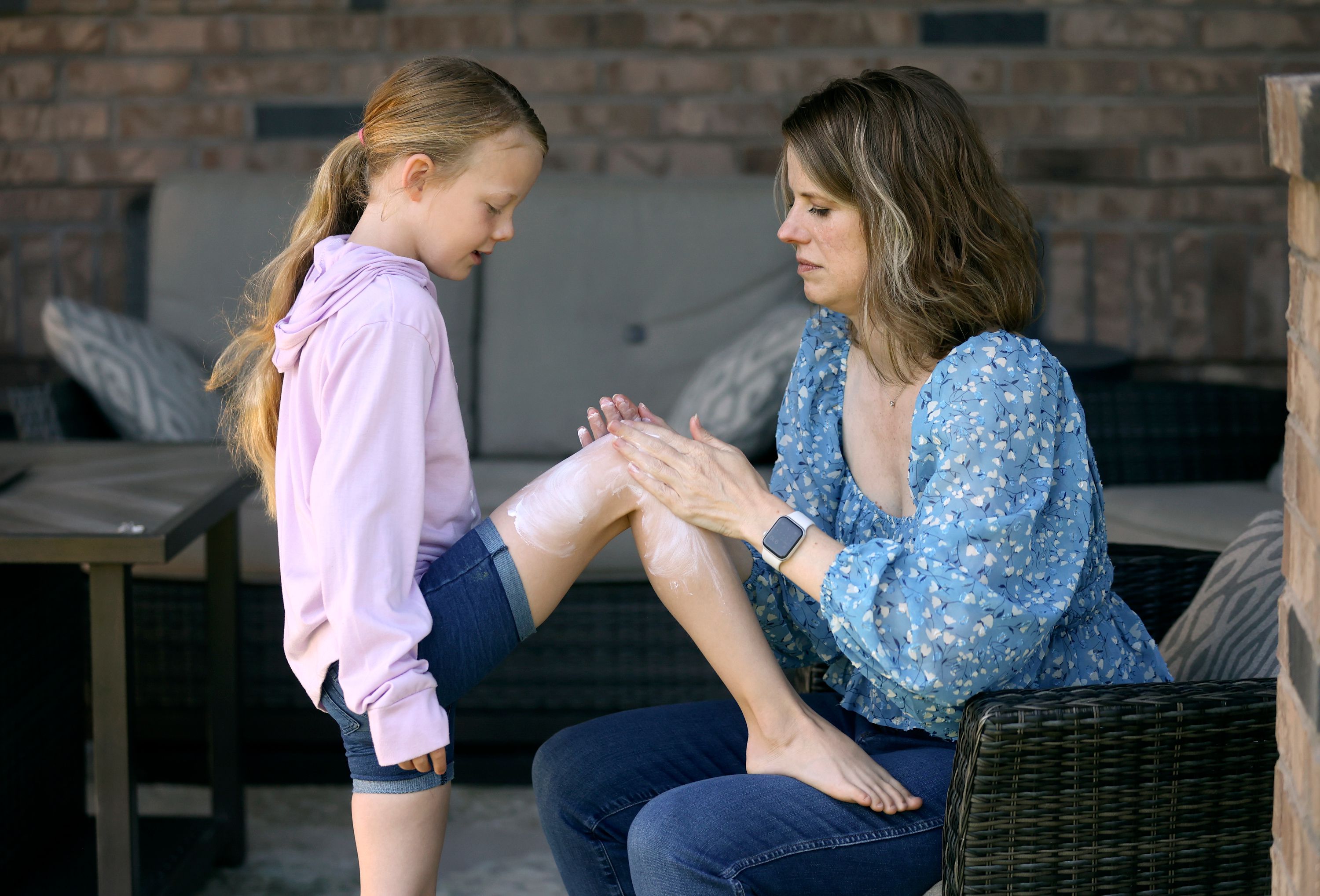 MaryAnn Gerber puts sunscreen on her daughter Maggie Gerber, 8, at their home in Layton on Tuesday. Experts encourage Utahns to lather on the SPF this summer — the state has the highest skin cancer rate nationwide.