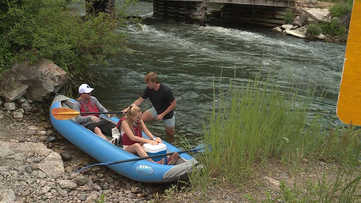 River guides and floaters getting ready to go back into the waters of the Provo River Thursday.