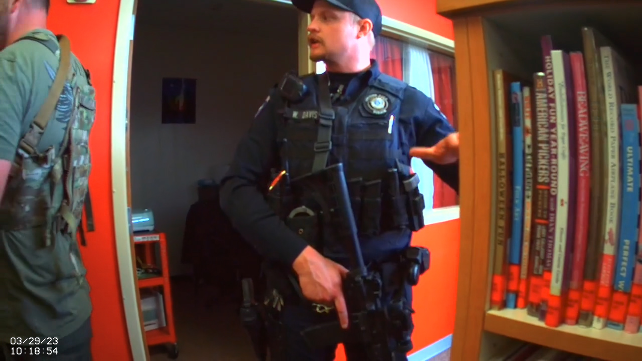 Body camera footage shows an armed officer in a library at Spanish Fork High School on March 29.