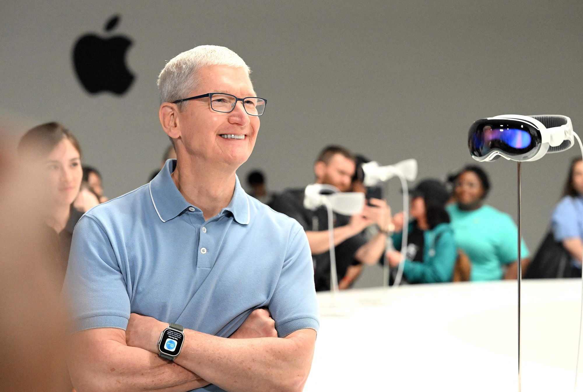 Apple CEO Tim Cook speaks with members of the media next to Apple's new Vision Pro virtual reality headset, during Apple's Worldwide Developers Conference at the Apple Park campus in Cupertino, Calif., on June 5.