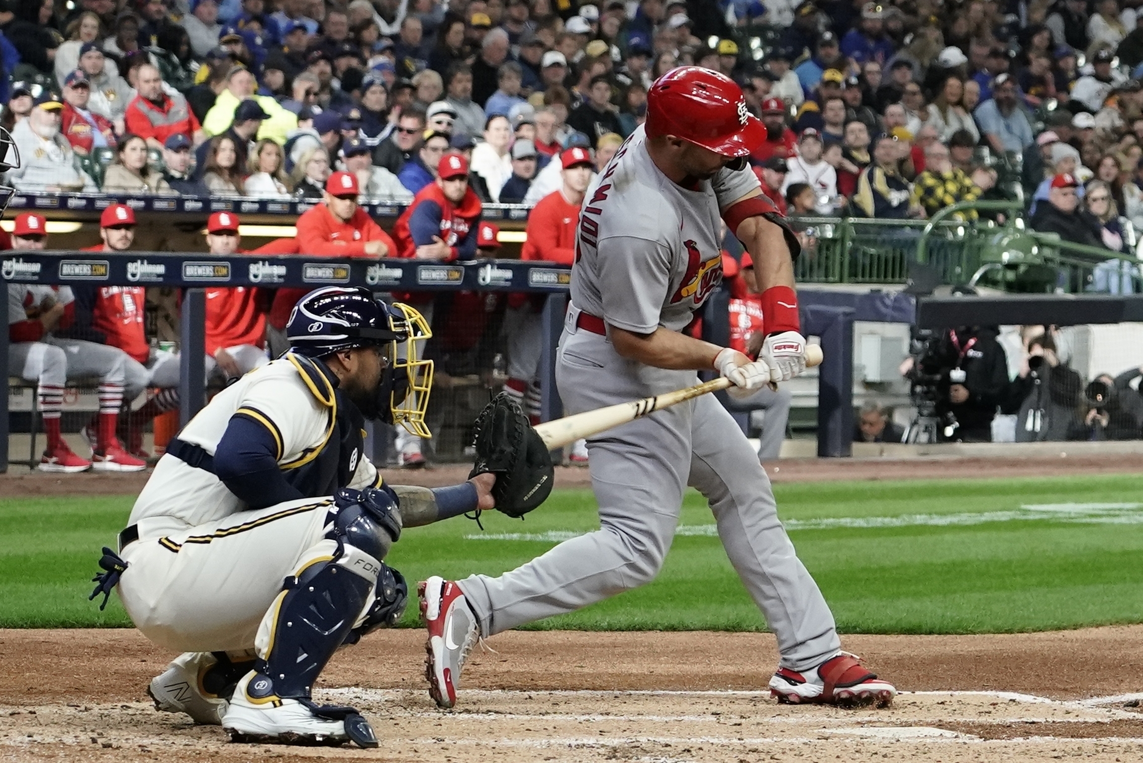 FILE - Milwaukee Brewers catcher Omar Narvaez is called for catchers interference as St. Louis Cardinals' Paul Goldschmidt hits during the third inning of a baseball game Thursday, April 14, 2022, in Milwaukee. The major leagues have seen a marked increase in catcher interference calls this season. Through Thursday's, June 29 big league games, there had been 57 catcher interference calls, up from 38 at the same point last year. 