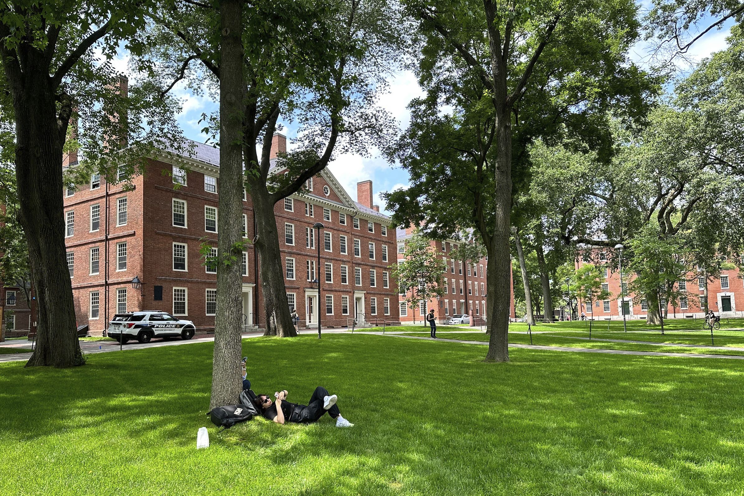 A person relaxes at Harvard University on Thursday in Cambridge, Mass. The Supreme Court on Thursday struck down affirmative action in college admissions, declaring race cannot be a factor and forcing institutions of higher education to look for new ways to achieve diverse student bodies.