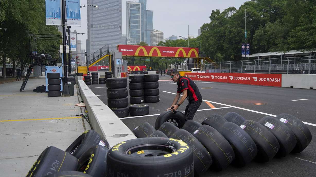 Joe Gibbs racing crew member John Ianham checks tires as preparation for the inaugural NASCAR Chicago Street Race Weekend continues Friday, June 30, 2023, in downtown Chicago.