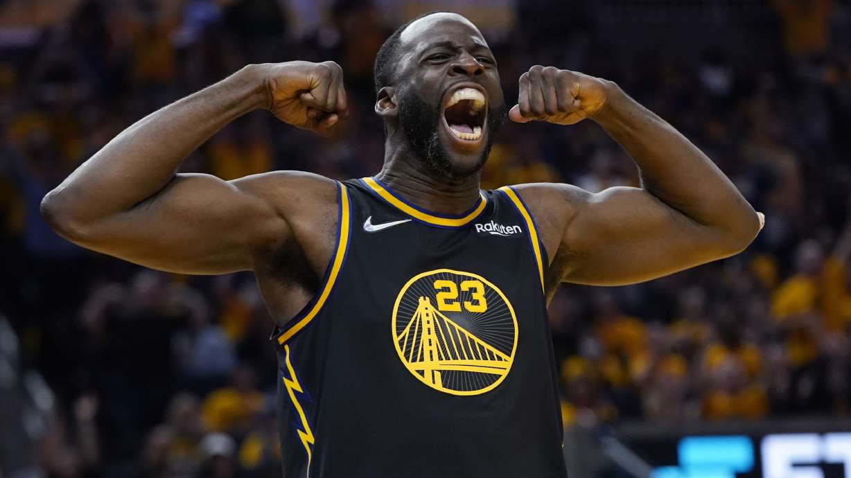 FILE - Golden State Warriors forward Draymond Green celebrates after scoring against the Dallas Mavericks during the second half in Game 5 of the NBA basketball playoffs Western Conference finals in San Francisco, Thursday, May 26, 2022. The Warriors want to keep Green, yet the team is prepared for him to formally decline his $27.5 million player option for the final year of his contract next season and become an unrestricted free agent seeking a long-term deal.