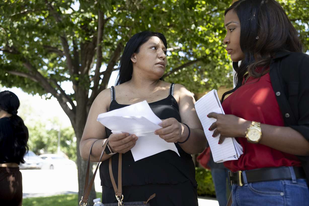 Cecilia Castillo speaks to Brandi Tillman, director of property management for the Housing Authority of Salt Lake City, in Salt Lake City on Friday. Tenants of the Housing Assistance Management Enterprise apartments delivered a collective letter to the president of the apartments demanding an end to the rent increase and the opportunity to negotiate collectively for a fair lease.