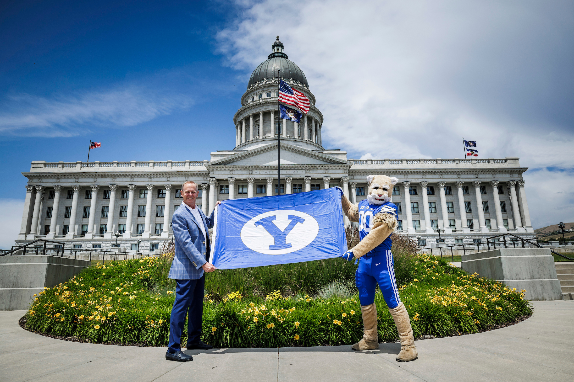 Utah Lt. Gov. Deidre Henderson presented BYU athletic director Tom Holmoe with an official declaration from Gov. Spencer Cox that the 1st of July 2023 be declared as BYU Big 12 Conference Day in Utah at the state capitol on June 29, 2023.