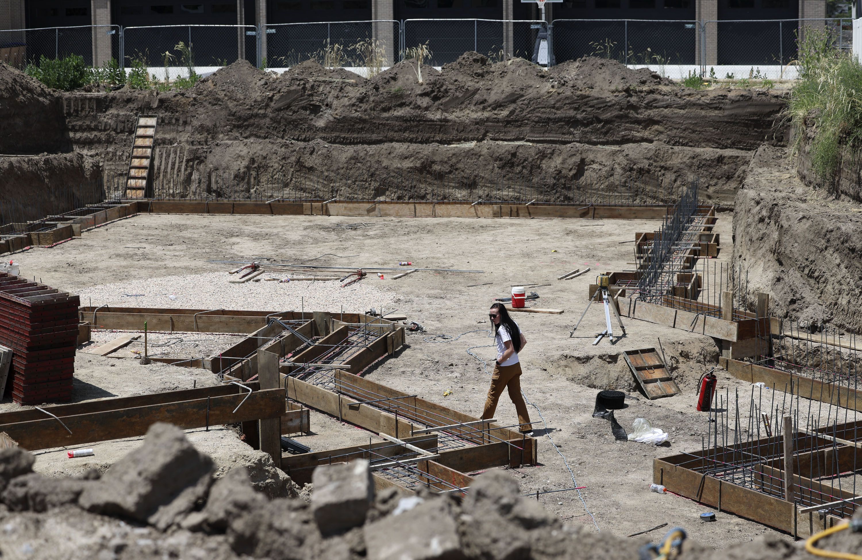General contractor Stephanie Dailey walks through a job site in Draper on Thursday, June 29, 2023. A Utah Women and Leadership report shows that men perceive less gender bias in the workplace than women do. Utah men perceive bias slightly less than men do on a global scale.