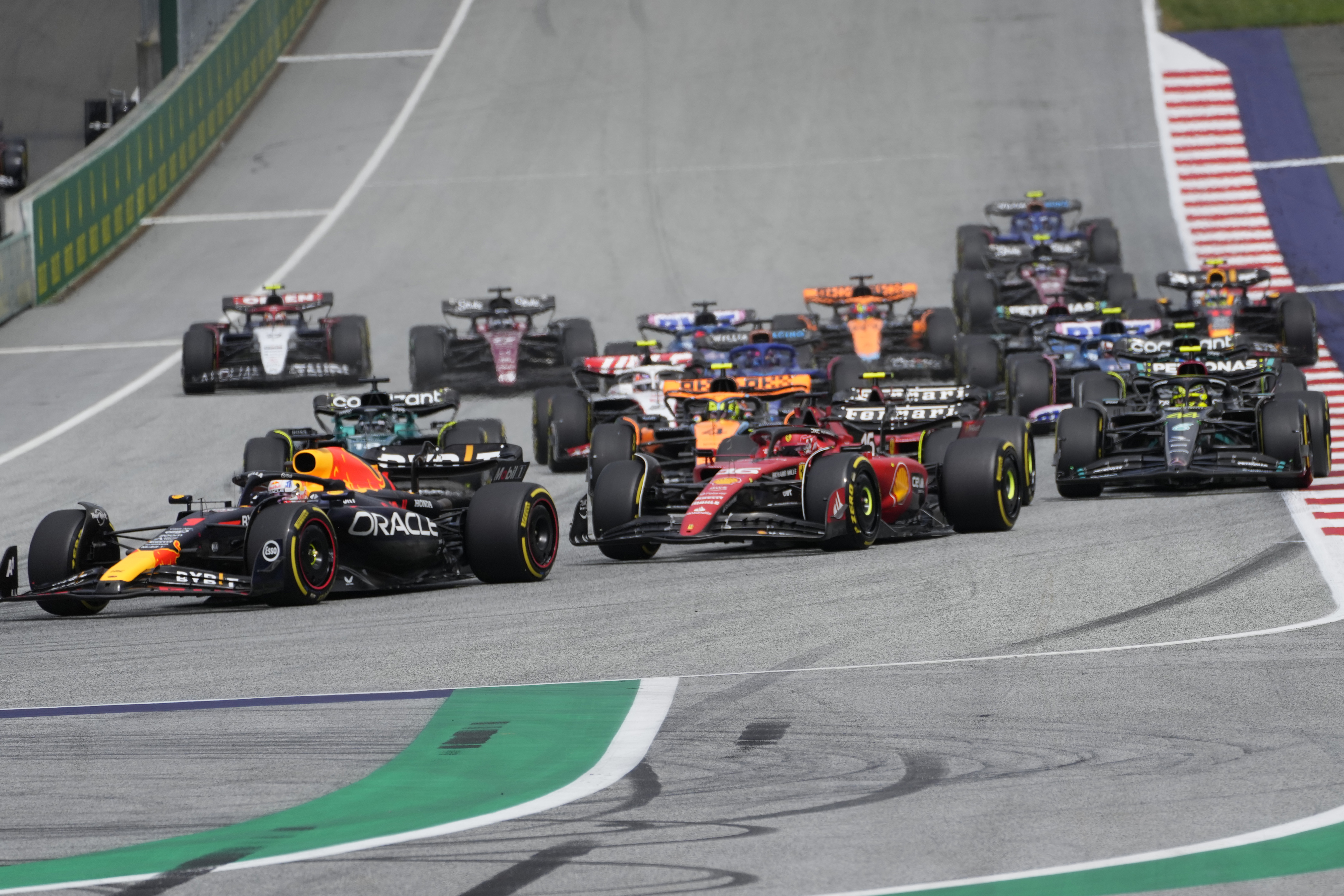 Red Bull driver Max Verstappen of the Netherlands, left, leads Ferrari driver Charles Leclerc of Monaco, center, and Mercedes driver Lewis Hamilton of Britain at the start of the Austrian Formula One Grand Prix, at the Red Bull Ring racetrack, in Spielberg, Austria, Sunday, July 2, 2023. 