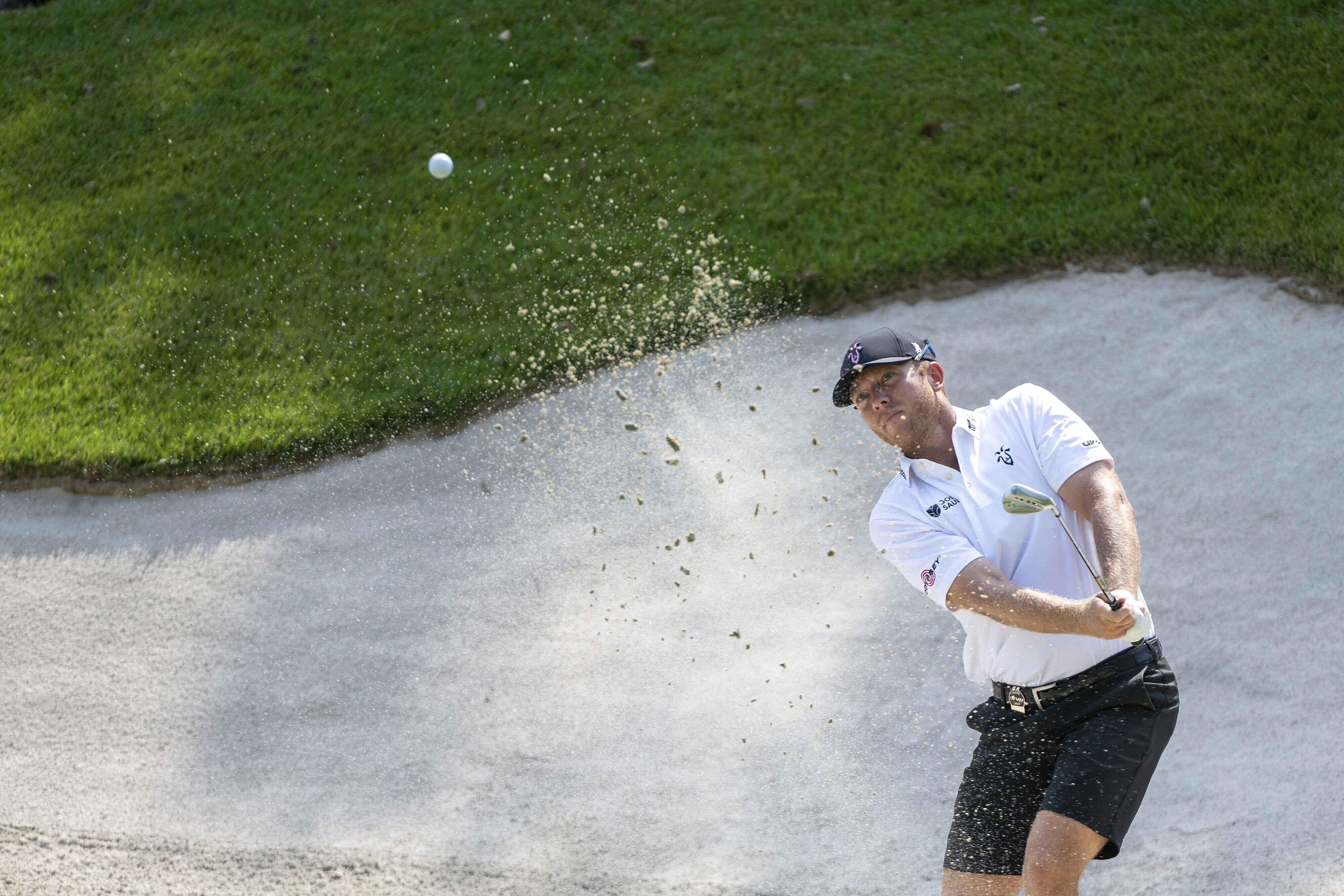 Talor Gooch hits his shot from a bunker on the 17th hole during the second round of LIV Golf-Valderrama golf tournament Saturday, July 1, 2023, in Sotogrande, Spain. 