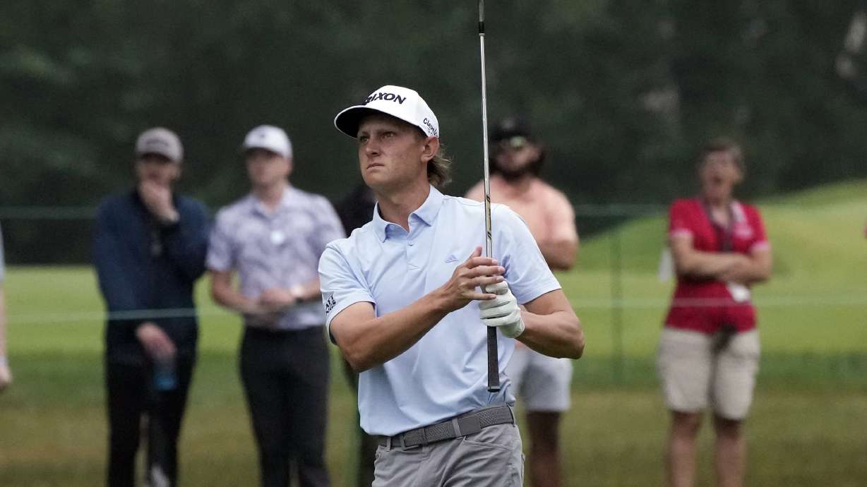 Peter Kuest hits his approach shot onto the first green during the final round of the Rocket Mortgage Classic golf tournament at Detroit Country Club, Sunday, July 2, 2023, in Detroit.