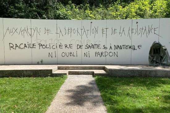 Graffiti reading "Police scum from Saint-Soline to Nanterre — do not forget or forgive" on a monument commemorating Holocaust victims and members of the French resistance memorial, Sunday in Paris suburb Nanterre.