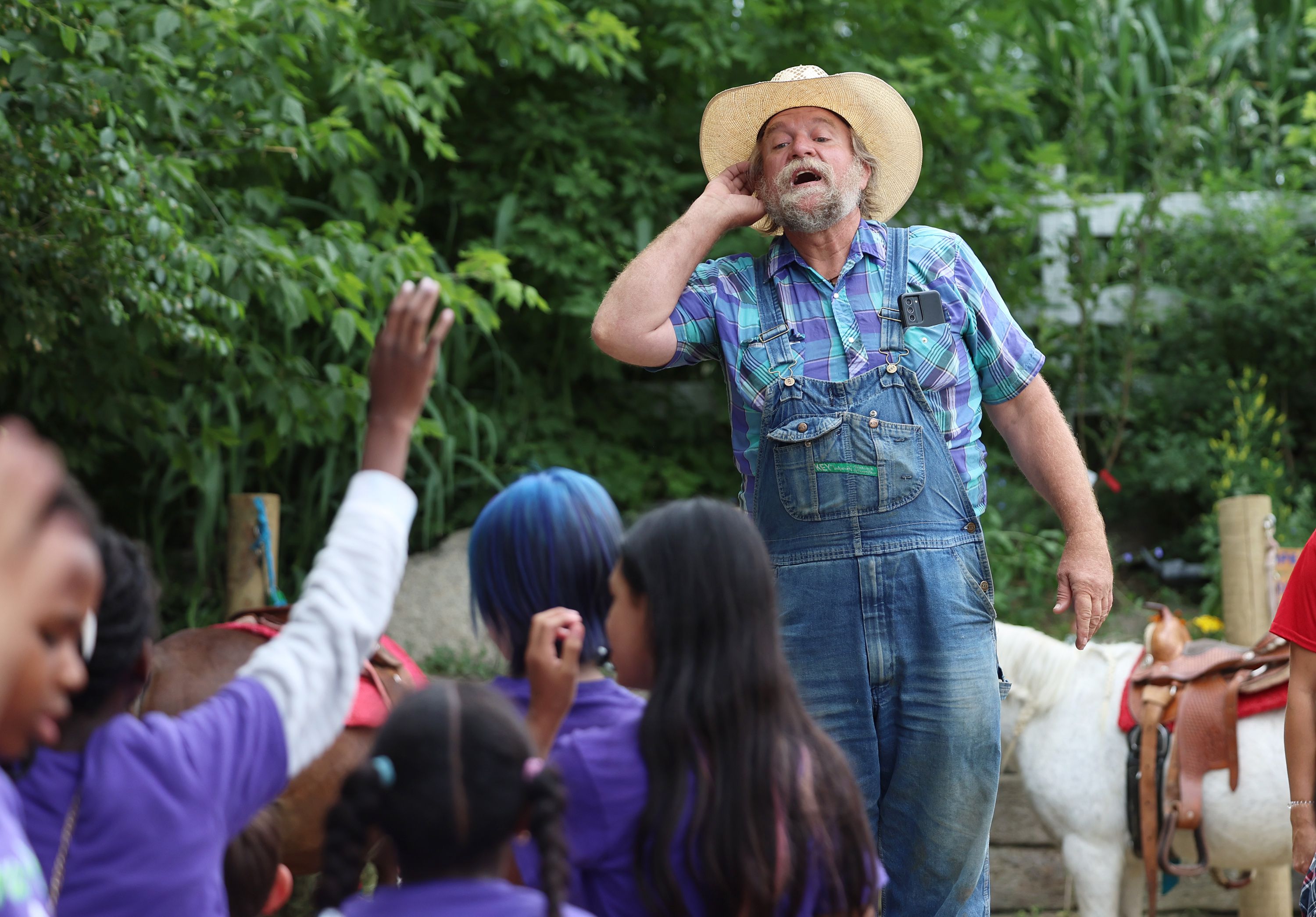 Gil Ma, the director of the farm at Gardner Village in West Jordan, talks with a school group that has come to tour the farm on June 20.