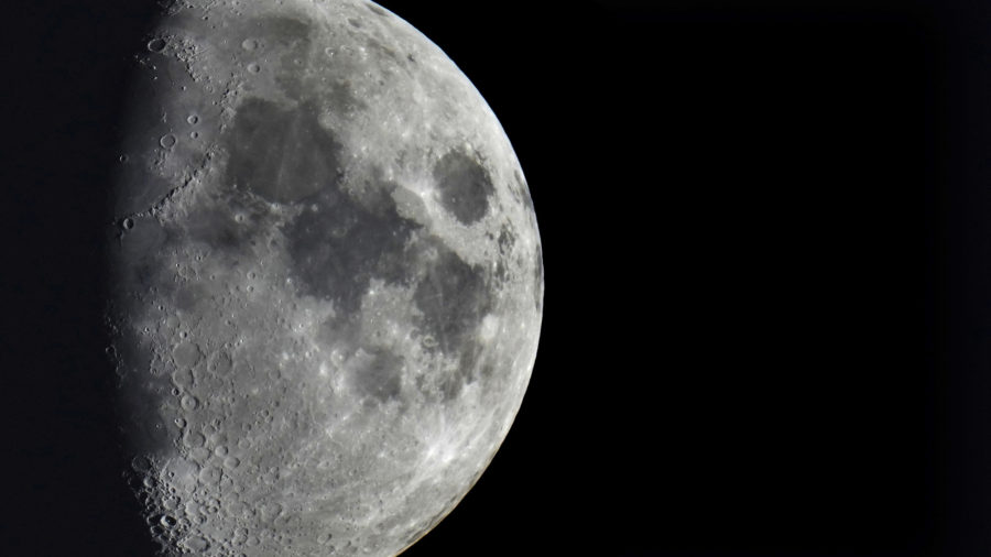 Impact craters cover the surface of the moon, seen from Berlin, Germany, Jan. 11, 2022.