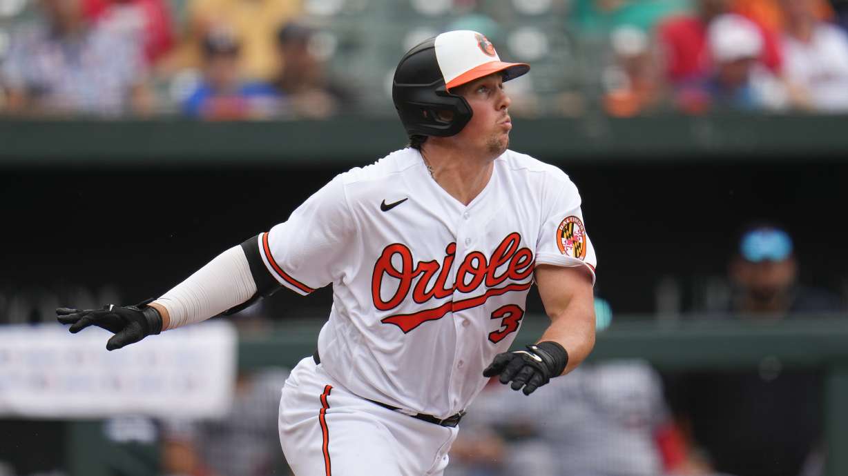 Baltimore Orioles' Adley Rutschman runs out of the box while hitting an infield single against the Minnesota Twins in the eighth inning of a baseball game, Sunday, July 2, 2023, in Baltimore. The Orioles won 2-1.