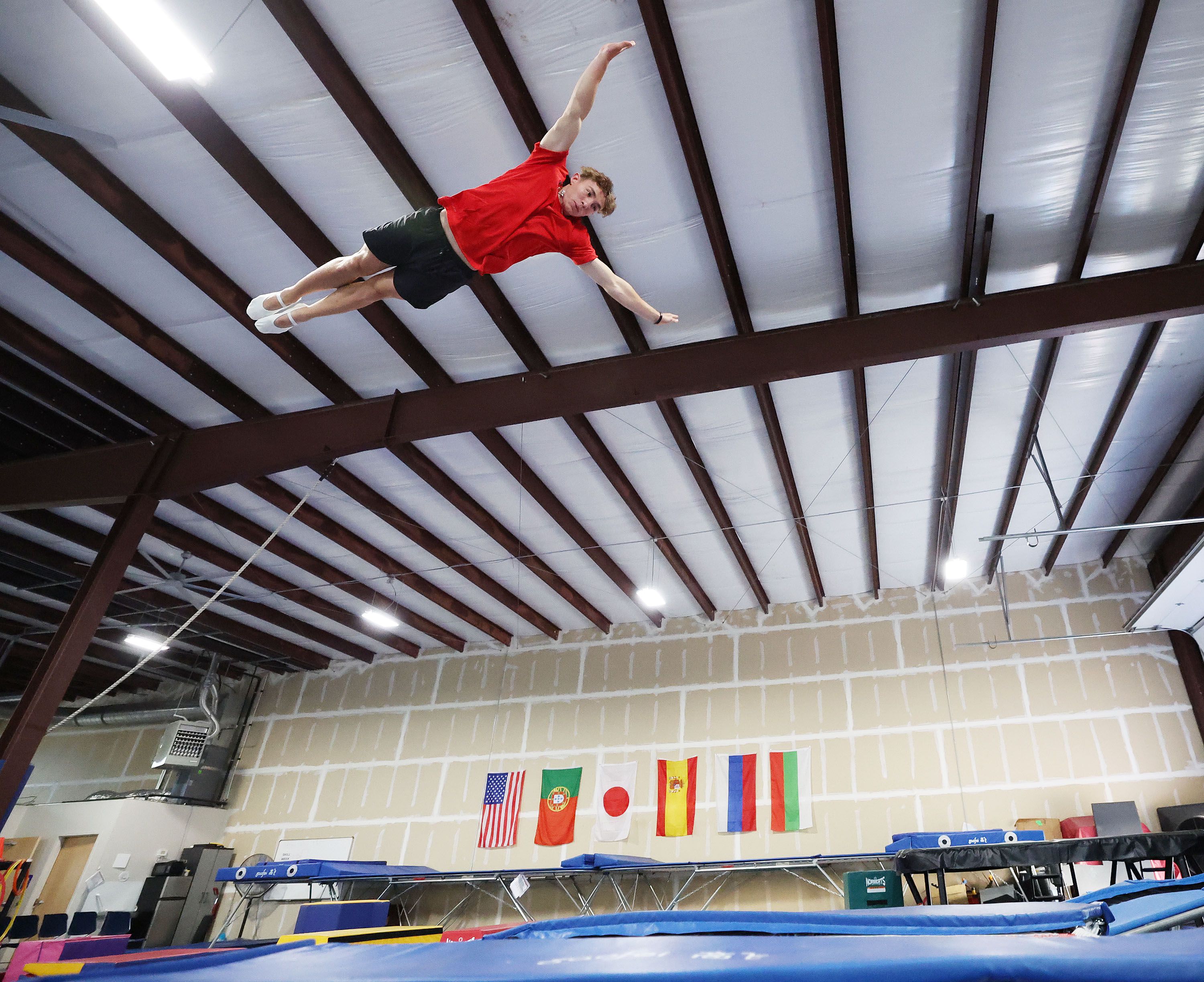 Simon Smith, of Springville, a gymnast representing Team USA for the upcoming Trampoline World Cup, works out in Orem on Thursday.