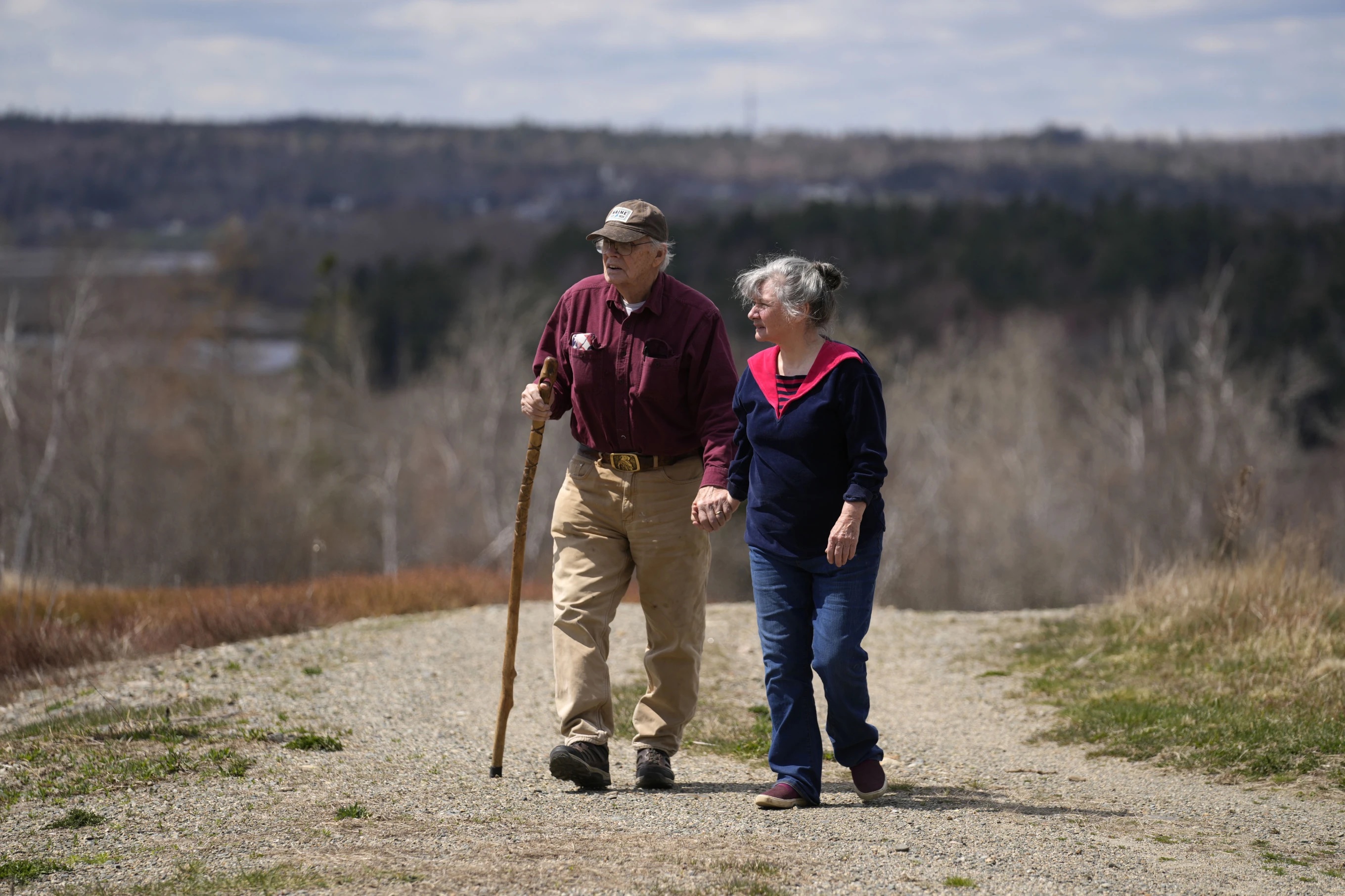 Dell and Marie Emerson walk behind their home, April 27 in Addison, Maine. The couple is opposed to a flagpole theme park that would destroying woodlands and supplant wild blueberry barrens that have been farmed by Native Americans for 10,000 years.