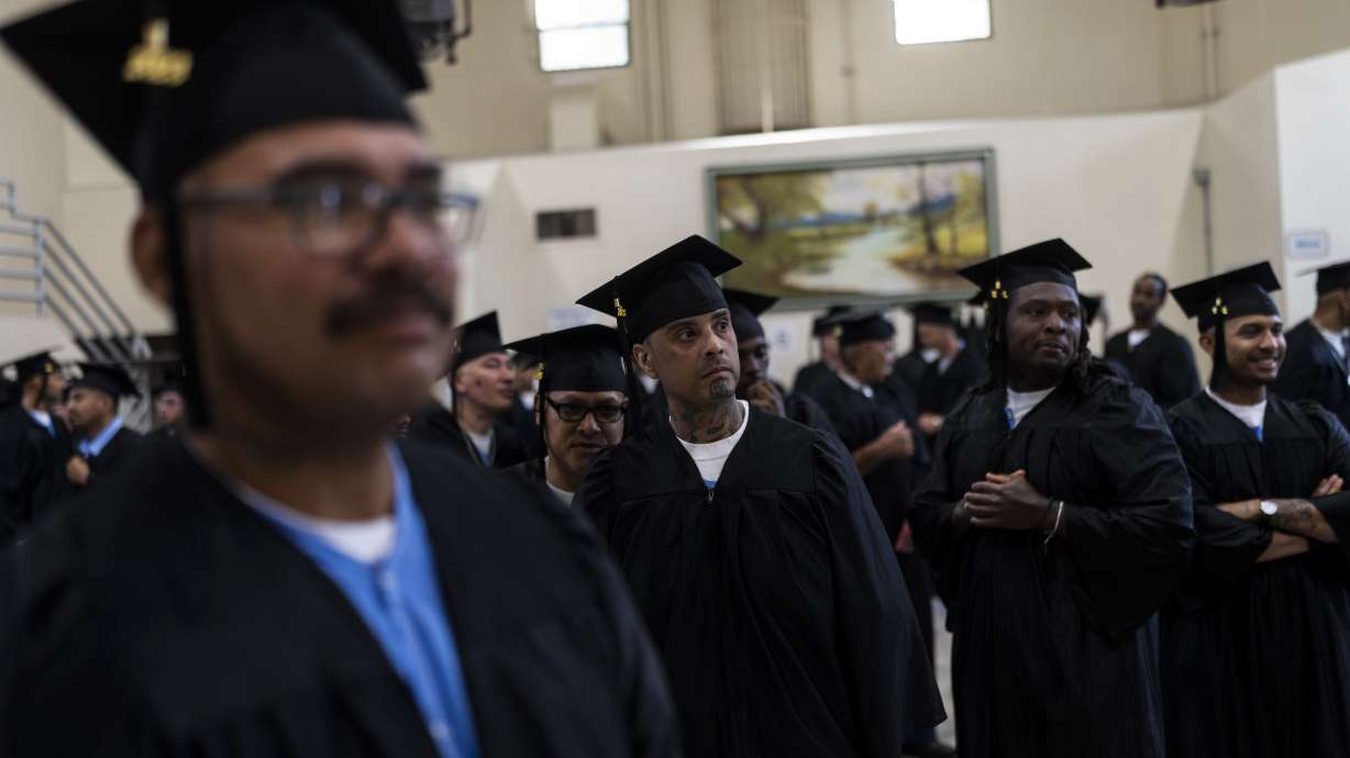 Incarcerated graduates, who finished various educational and vocational programs in prison, wait for the start of their graduation ceremony at Folsom State Prison in Folsom, Calif. on May 25, 2023.