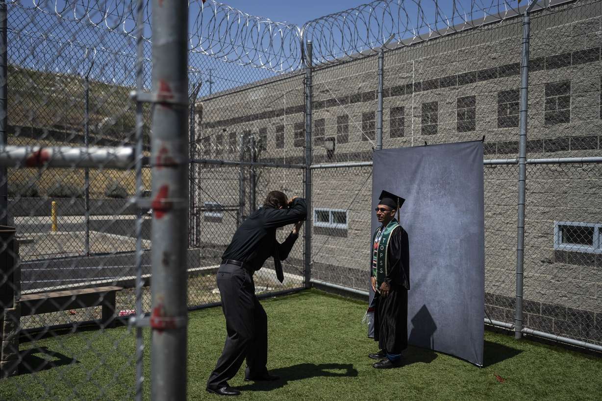 Incarcerated graduate Jose Catalan poses for photos after his graduation ceremony at Folsom State Prison in Folsom, Calif. on May 25, 2023.