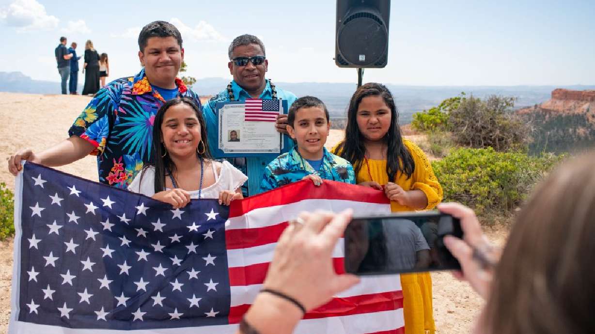 A family celebrates at Bryce Canyon National Park at the naturalization ceremony, Bryce, Thursday.