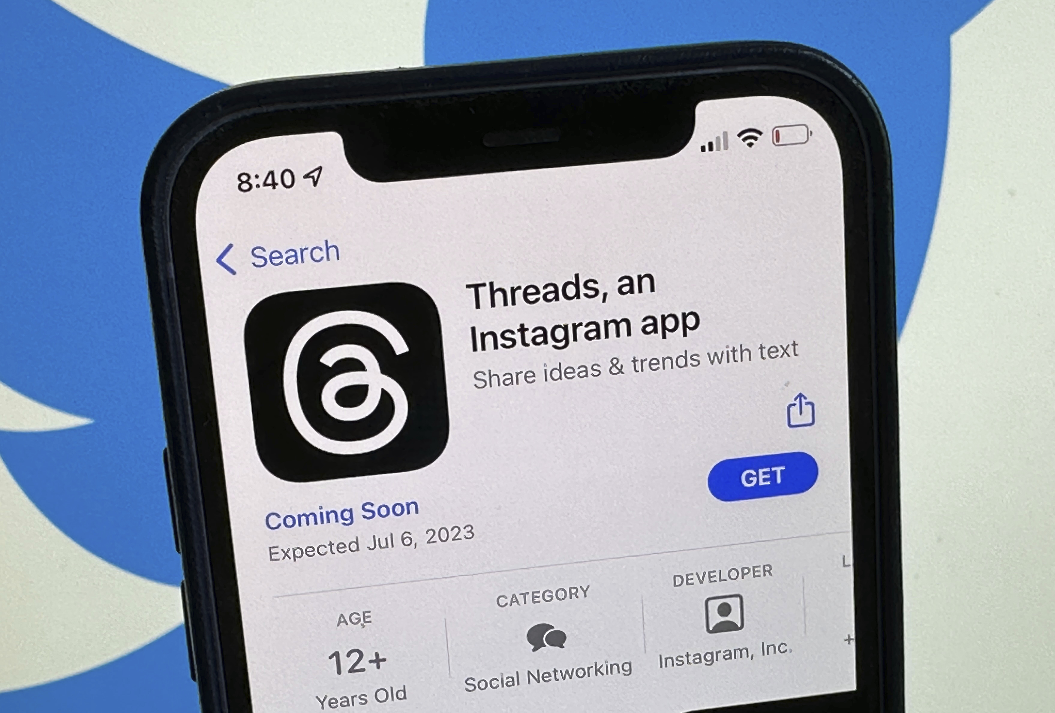 The announcement of the social media app 'Threads' is displayed in Apple's U.S. App Store seen on the screen of a smartphone in Berlin, Germany, on Tuesday. Meta is poised to launch a new app that appears to mimic Twitter in a direct challenge to the social media platform owned by billionaire Elon Musk. 