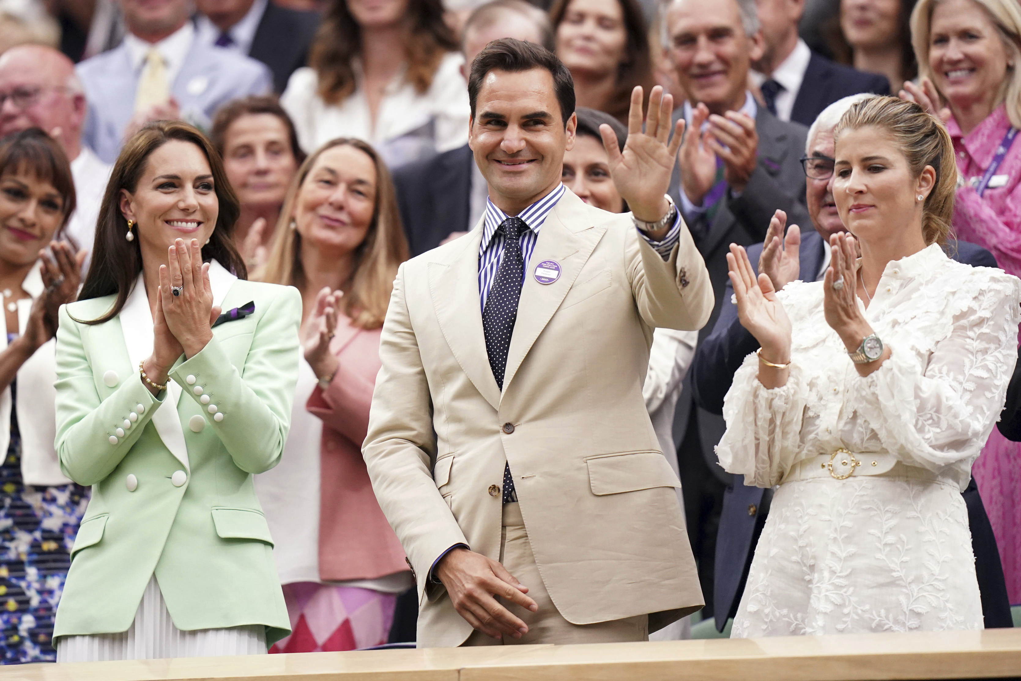 Britain's Kate, Princess of Wales, left, stands in the royal box with tennis champion Roger Federer and his wife Mirka, on day two of the Wimbledon tennis championships in London, Tuesday, July 4, 2023. 