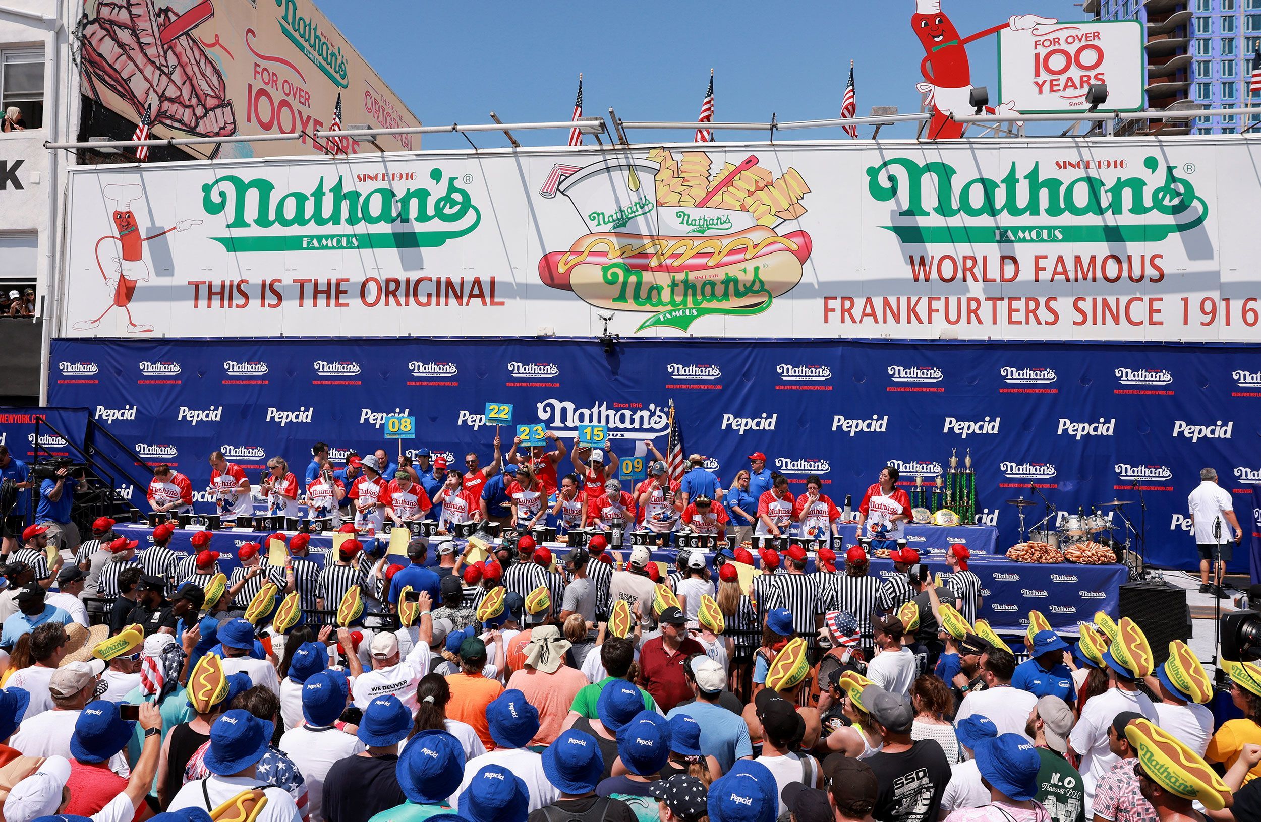 People compete in the 2023 Nathan's hot dog eating contest at Coney Island in New York City on July 4, 2023.