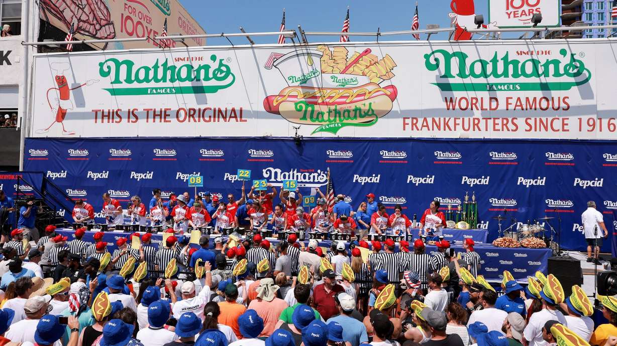 People compete in the 2023 Nathan's hot dog eating contest at Coney Island in New York City on July 4, 2023.