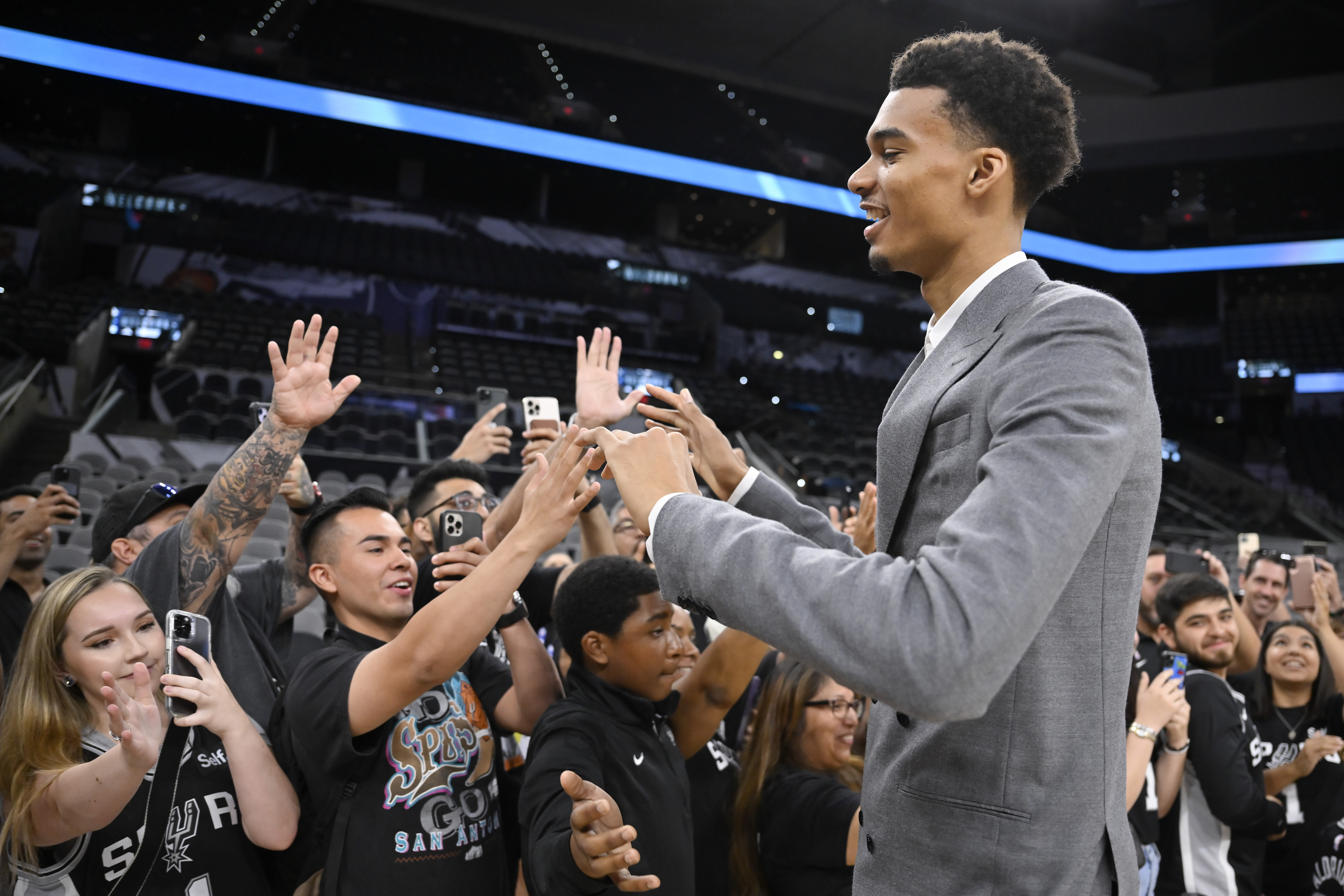 San Antonio Spurs' Victor Wembanyama, the No. 1 draft pick, greets fans before an NBA basketball press conference, Saturday, June 24, 2023, at the AT&T Center in San Antonio. 