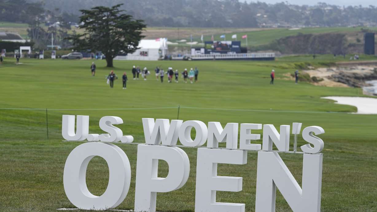 Golfers walks down the 18th fairway during a practice round for the U.S. Women's Open golf tournament at the Pebble Beach Golf Links, Tuesday, July 4, 2023, in Pebble Beach, Calif.
