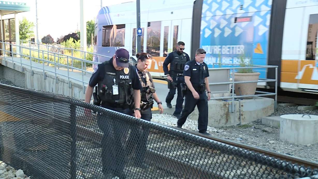 Unified and Utah Transit Authority police search for the gun used in an alleged shooting at the Utah Transit Authority Meadowbrook TRAX station, at 188 W. 3900 South, Tuesday.