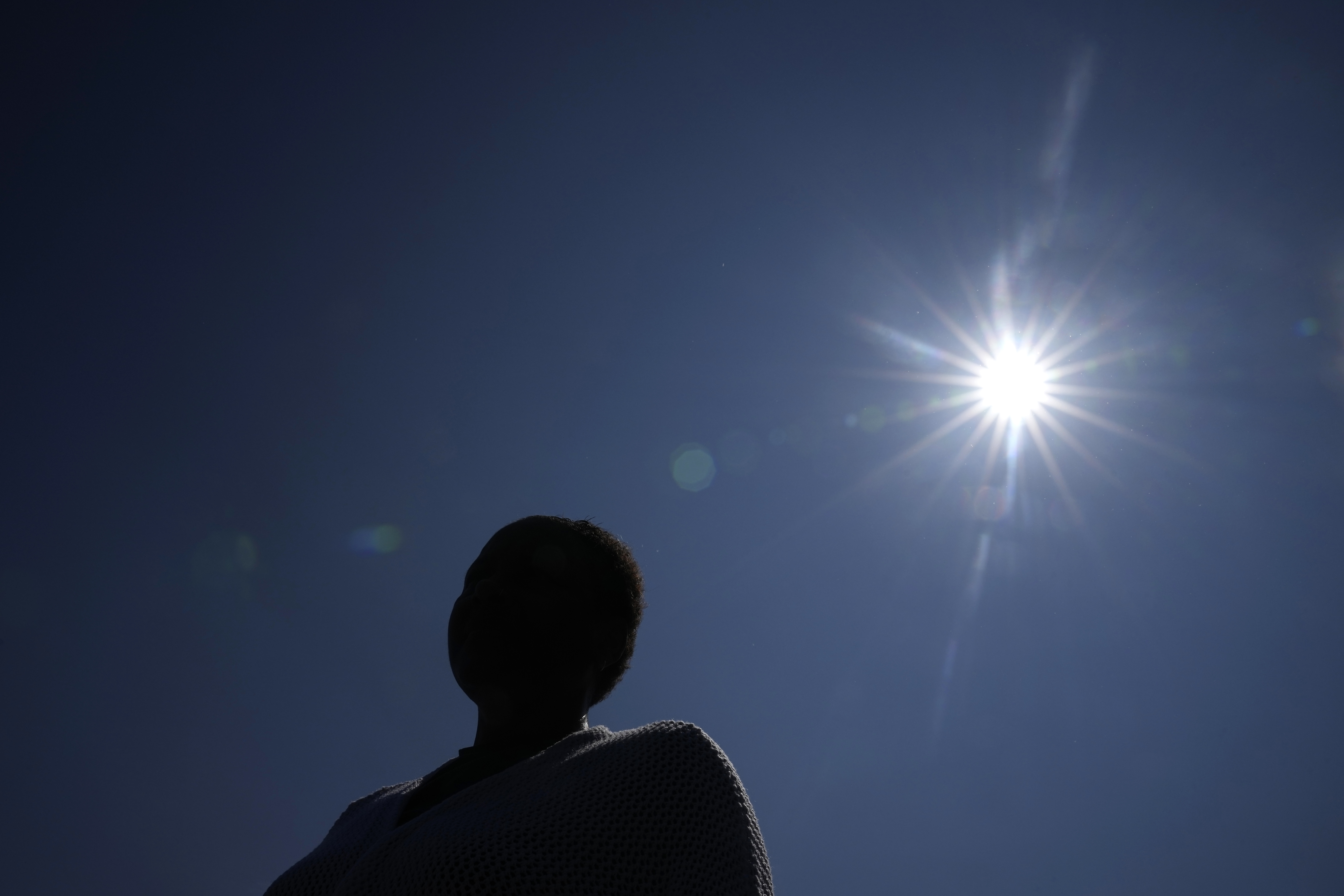 The mother of a student whose confidential sexual assault complaint was released online stands outside the Minneapolis Public Schools offices, June 1 in Minneapolis. Ransomware gangs have been stealing confidential documents from schools and dumping them online. 