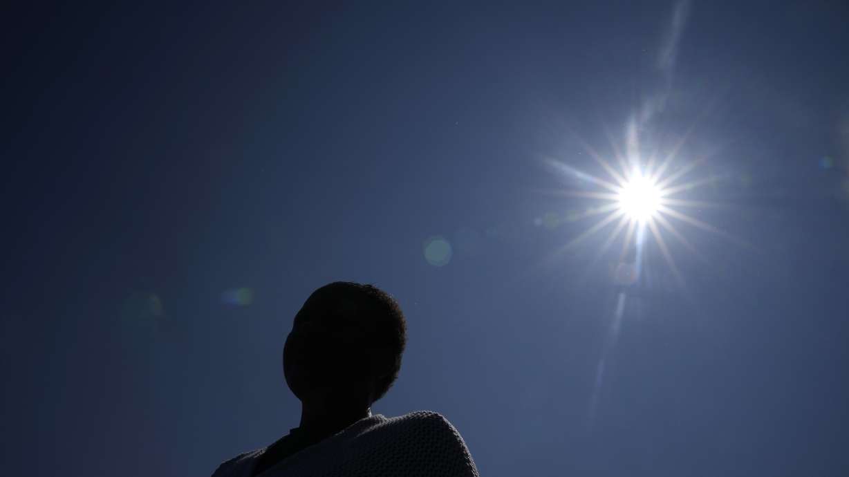 The mother of a student whose confidential sexual assault complaint was released online stands outside the Minneapolis Public Schools offices, June 1 in Minneapolis. Ransomware gangs have been stealing confidential documents from schools and dumping them online.