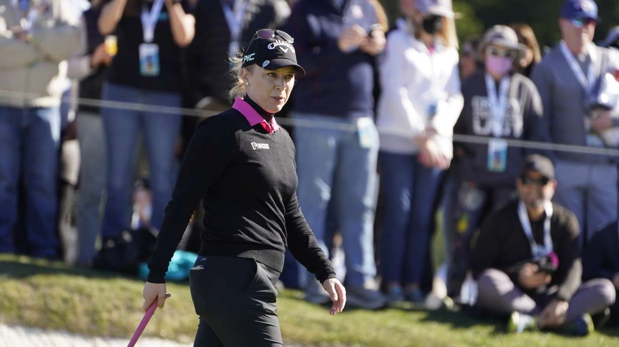 FILE - Morgan Pressel reads a green on The Hay short course during the celebrity challenge event of the AT&T Pebble Beach Pro-Am golf tournament in Pebble Beach, Calif., Feb. 2, 2022. Pressel considered extending her playing career so that she would have the opportunity to play in this week's U.S. Women's Open at Pebble Beach. Pressel is going into her third Women's Open as NBC's analyst.