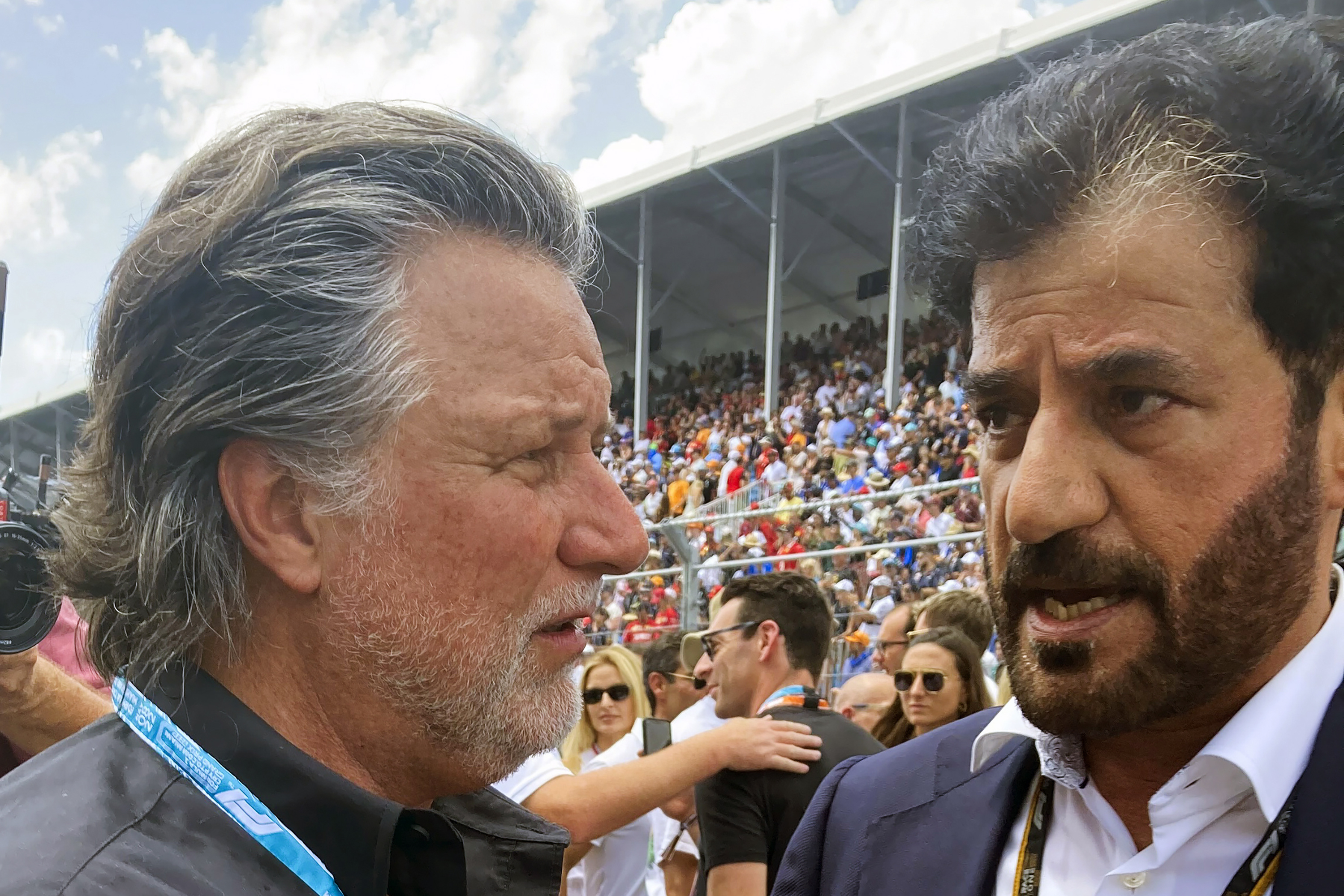 FILE - Michael Andretti, left, talks with FIA President Mohammed bin Sulayem before the Formula One Miami Grand Prix auto race at Miami International Autodrome, Sunday, May 8, 2022, in Miami Gardens, Fla. The FIA has received “more than five” expressions of interest from teams interested in joining Formula One, the president of the governing body told The Associated Press on Wednesday, July 5, 2023, with a decision on expansion expected by the end of the month. The bid that stands out most to Mohammed Ben Sulayem is from Andretti Global and General Motors — a supportive sign that Michael Andretti may indeed get the F1 team he's been fiercely chasing. 