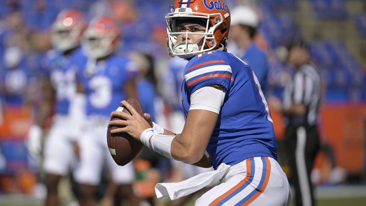 FILE - Florida quarterback Jalen Kitna (11) warms up before an NCAA college football game against Eastern Washington, Sunday, Oct. 2, 2022, in Gainesville, Fla. Ex-Florida quarterback Jalen Kitna, the son of retired NFL quarterback Jon Kitna, accepted a plea deal Wednesday, July 5, 2023, that dismissed five felony child pornography charges stemming from his arrest last November.